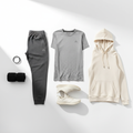 Men's activewear flat lay featuring joggers, performance t-shirt, and lightweight hoodie